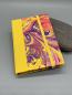 Preview: Immerwährender Taschenkalender Marmoriert – Vorderdeckel Variante Gelb mit Swirl-Marmormuster, alternative Musteransicht