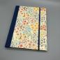 Preview: Notizheft im Steckbuch A5 Tiny Flowers – Vorderdeckel mit buntem Blumenmotiv und Golddruck