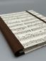 Preview: Notizen A6 auswechselbar Heft beige braun Noten Lied Detail Bindung Leinenrücken