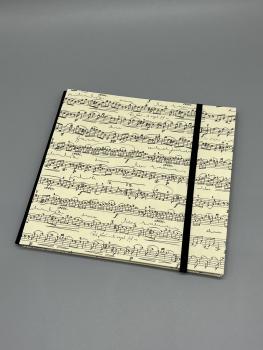 Buch Gummiband Fotos Seiten Faltung Faltbuch schwarz Musiknoten