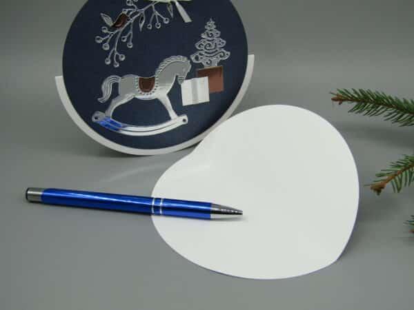 Weihnachten Grußkarte rund Schaukelpferd Innenseite Stift