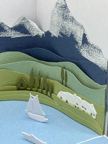 Geschenk Schachtel Überraschung Reise Gardasee Campingurlaub Berge Landschaft